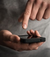 hand about to type a message on a phone