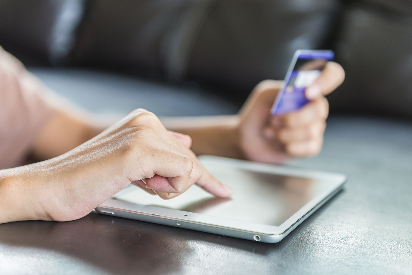 Person making payment on tablet