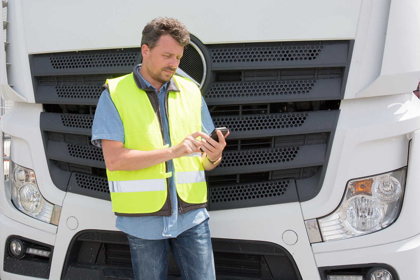 Person using phone outside of truck