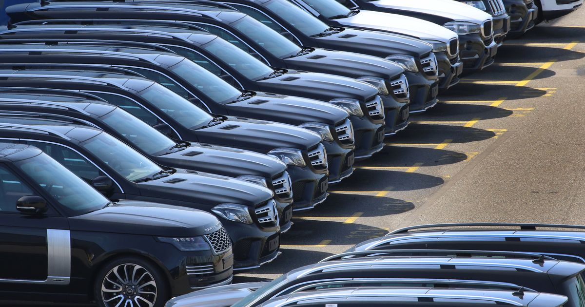 SUV's lined up in car park