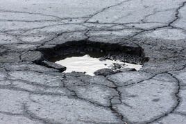 Pot hole in ground